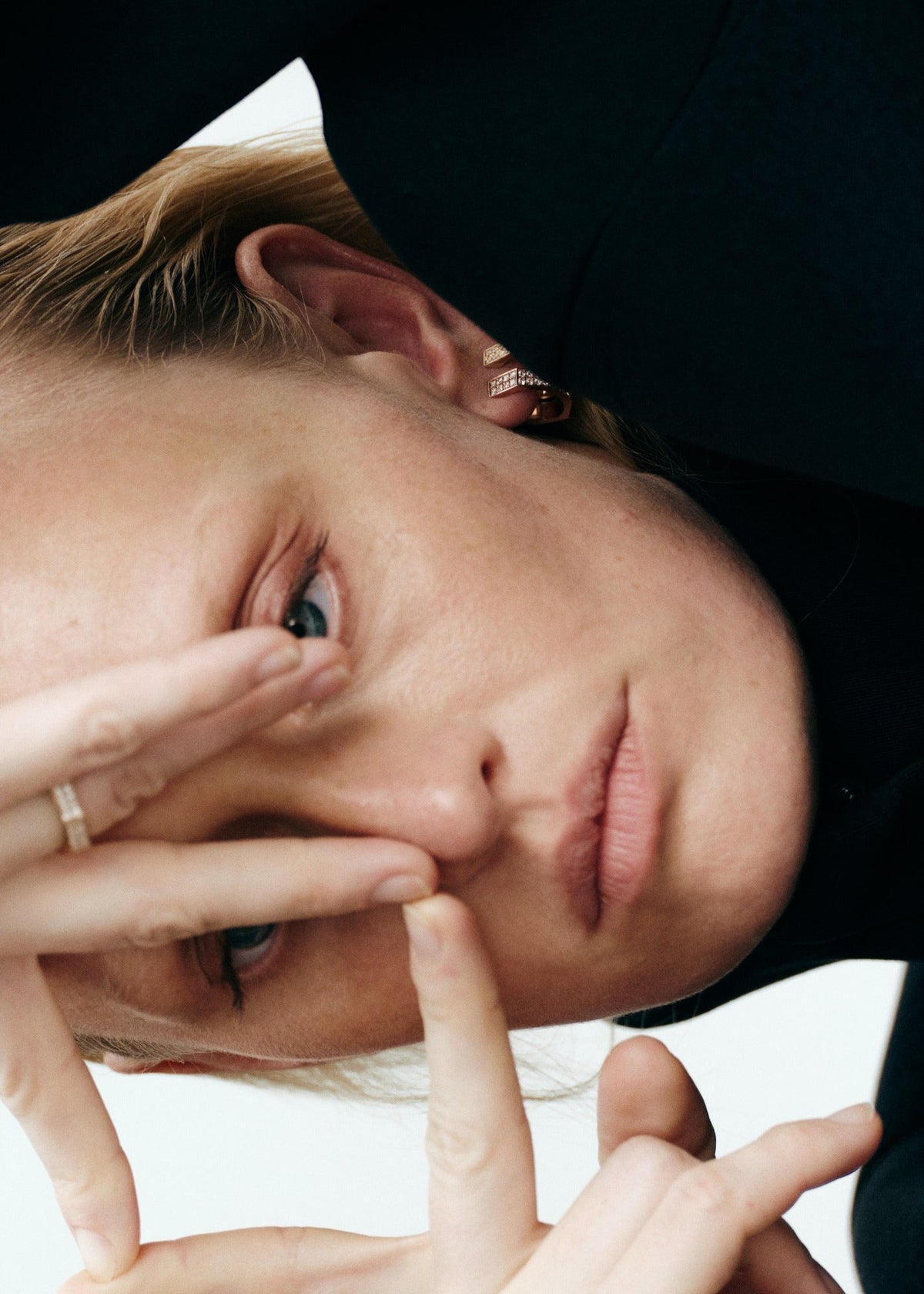 close-up color portrait wearing daŭre Oklatera ring and pavé earring