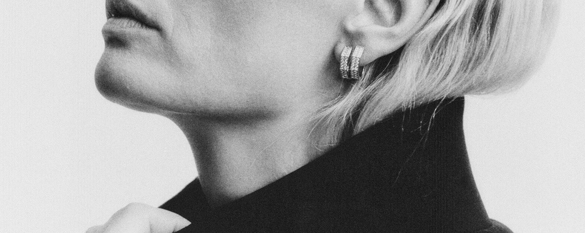 Woman in profile wearing Oklatera octagonal hoop earrings, pavé-set with lab-grown diamonds, daŭre collection